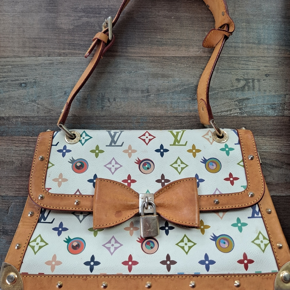 White multicolored accents with brown trim beautiful purse!